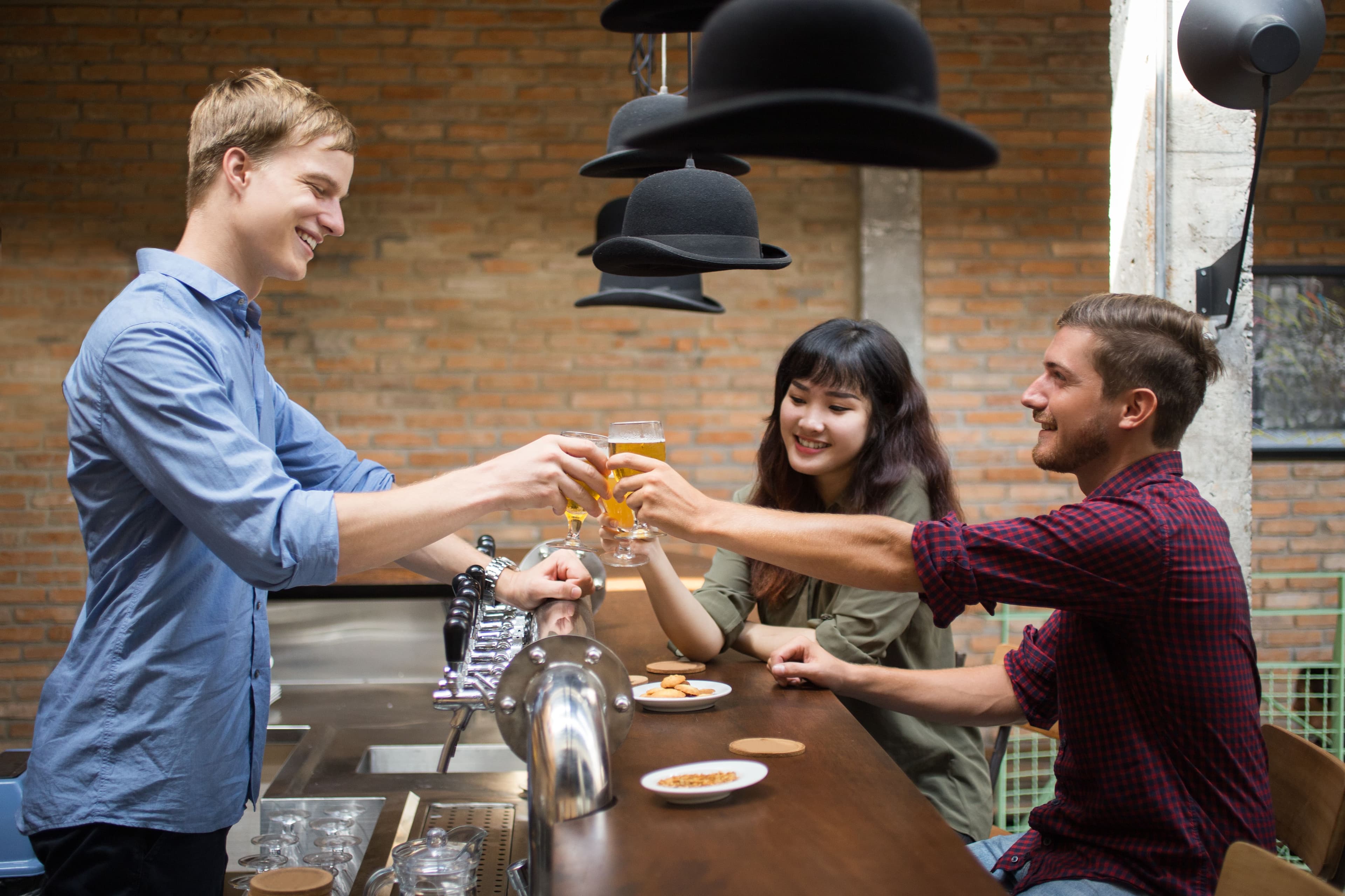 Guests toasting with drinks served by an Event Bartenders bartender