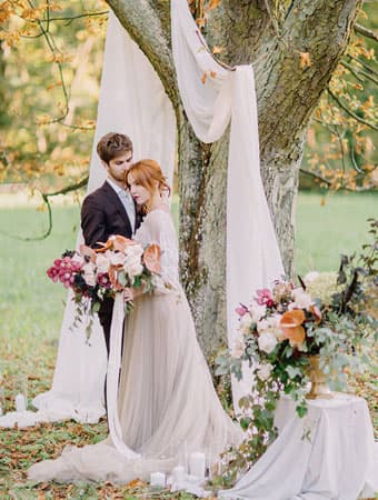 Outdoor Denver-area wedding ceremony with floral arrangements